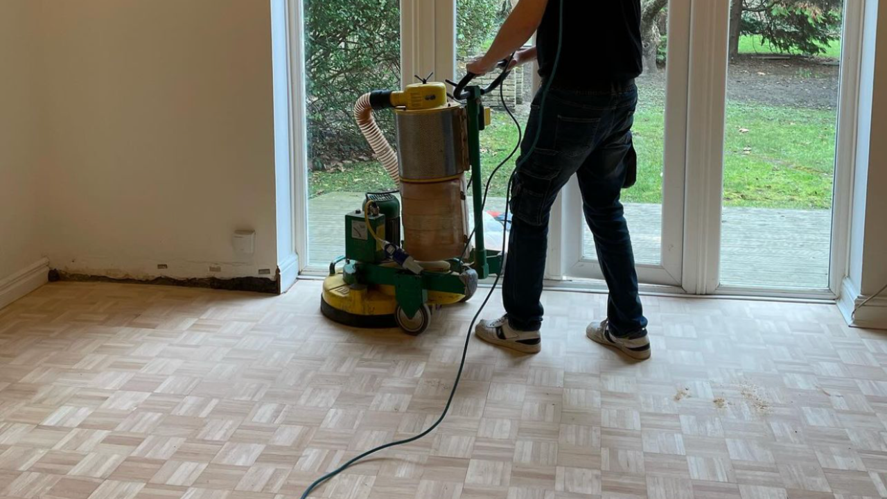 Wood Floor Sanding in Sydenham on light oak mosaic parquet flooring with a professional sanding machine during restoration