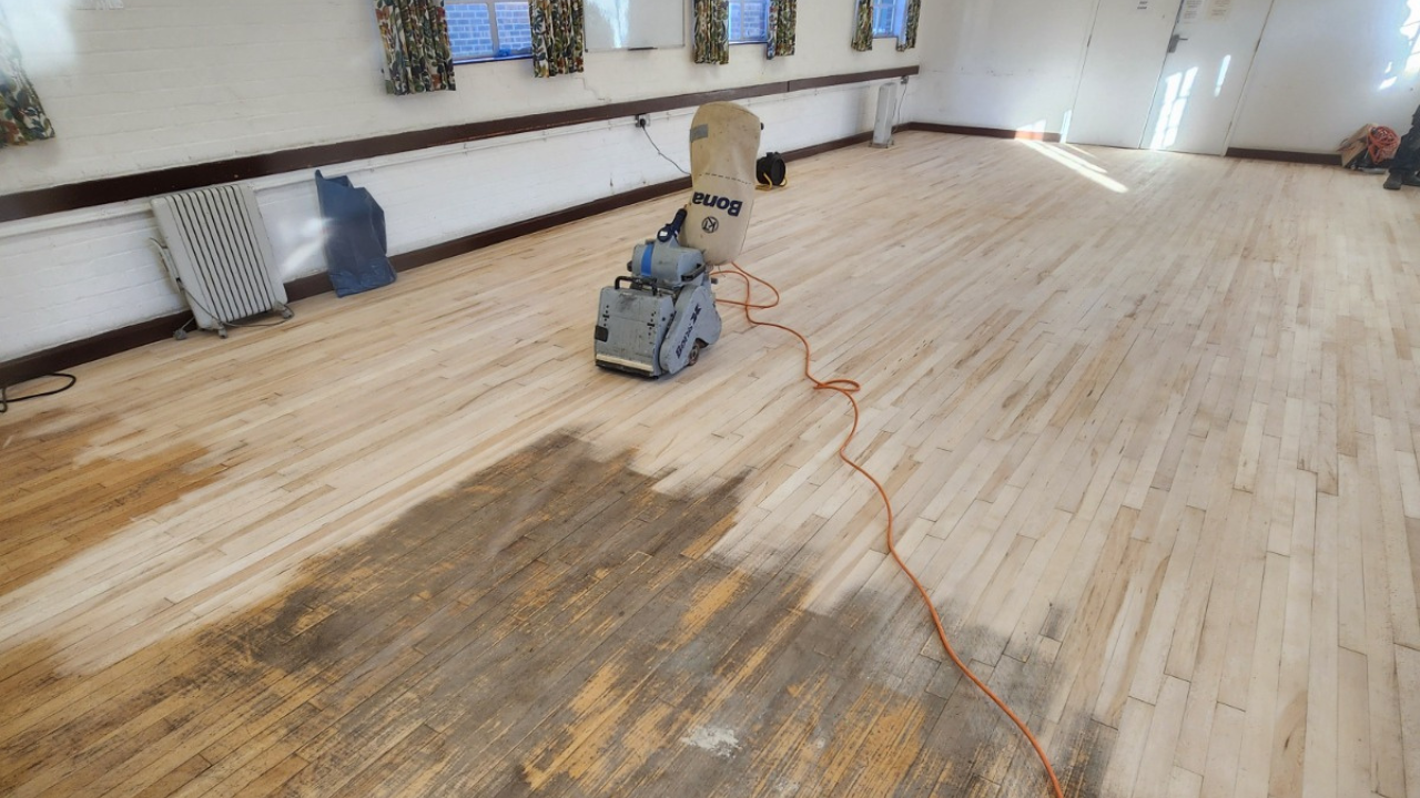 Wood Floor Sanding in Sydenham on maple hardwood strip flooring in a hall during professional restoration