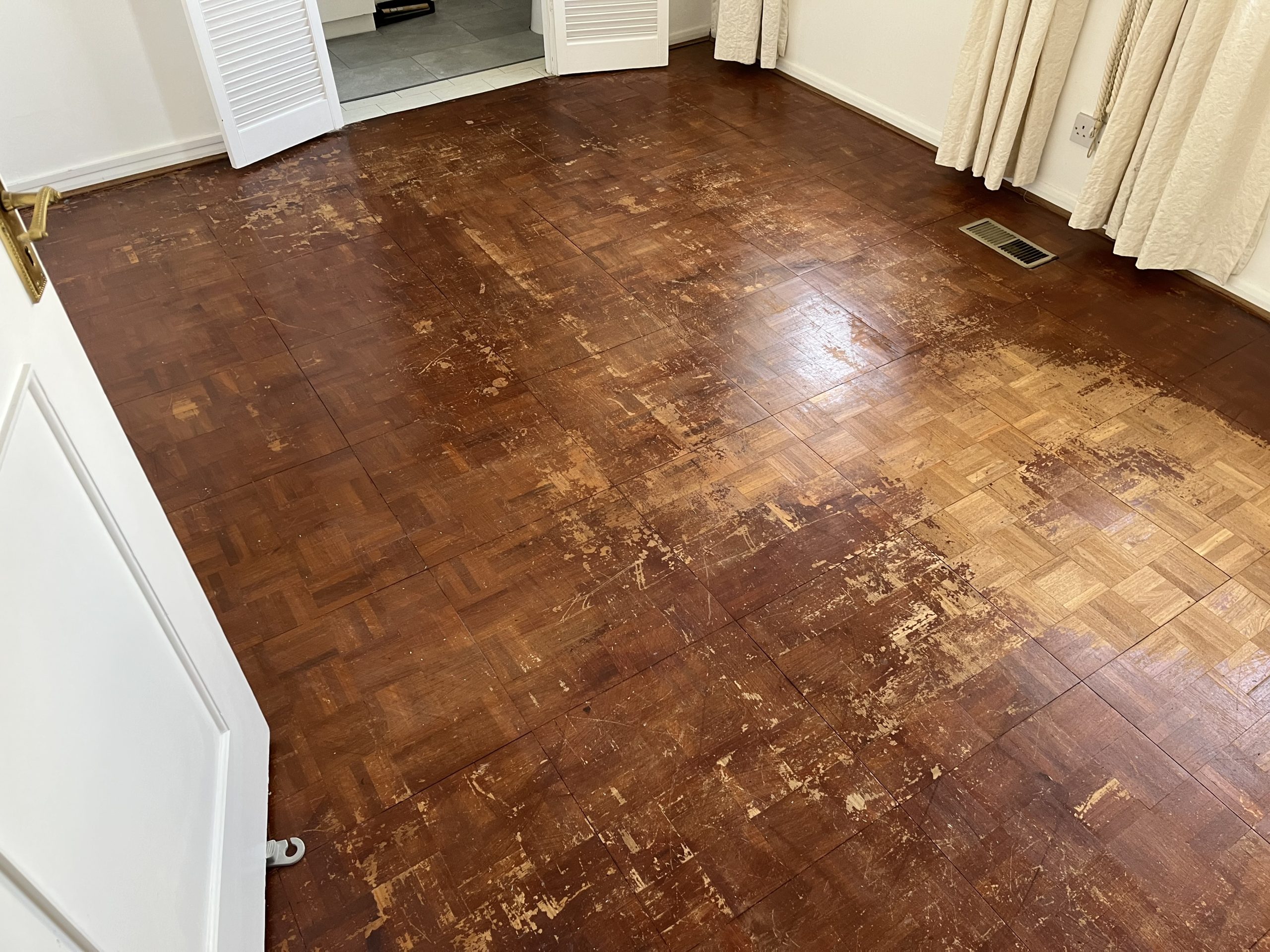 Wood Floor Sanding in Sydenham on worn oak parquet block flooring in a room before professional restoration